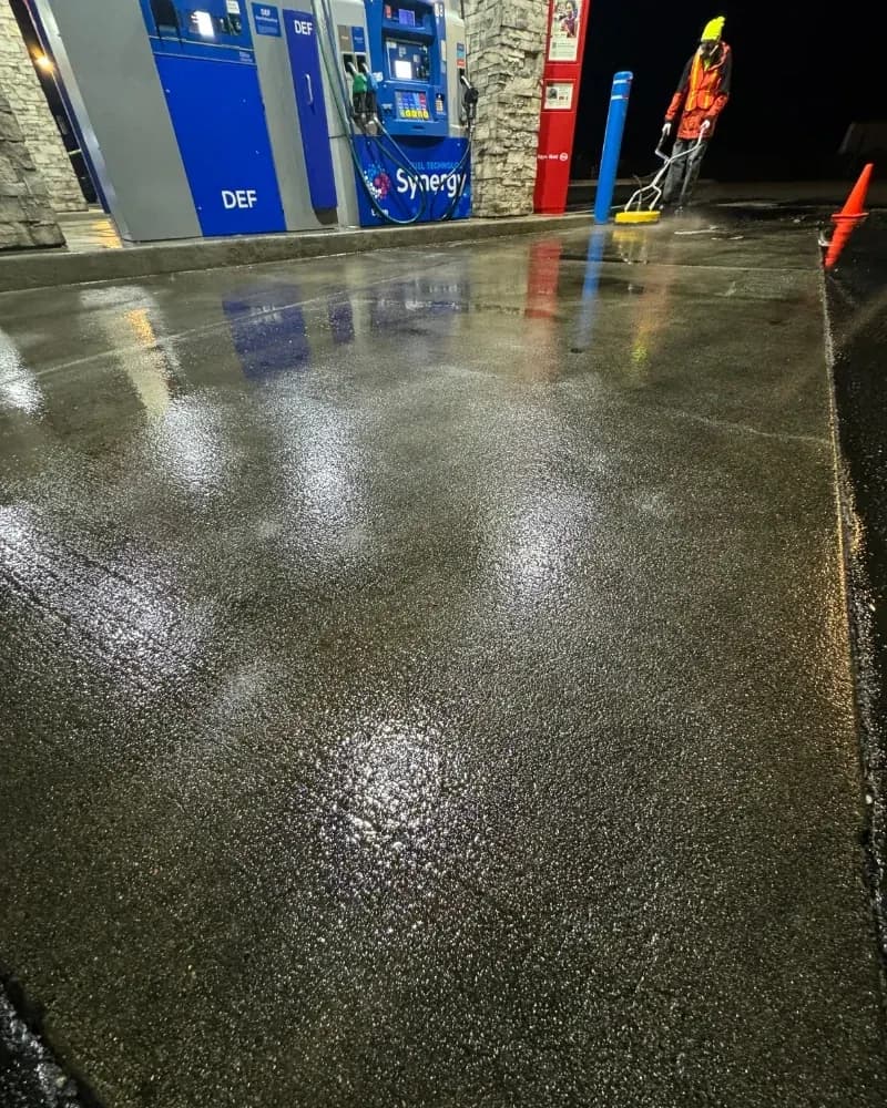 Gas station concrete pad before pressure washing